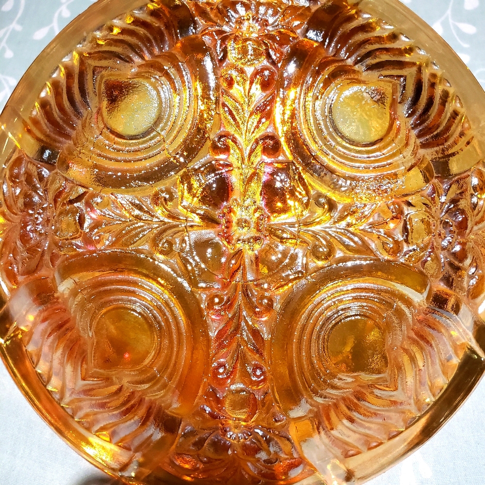 Carnival glass, irridescent marigold color.